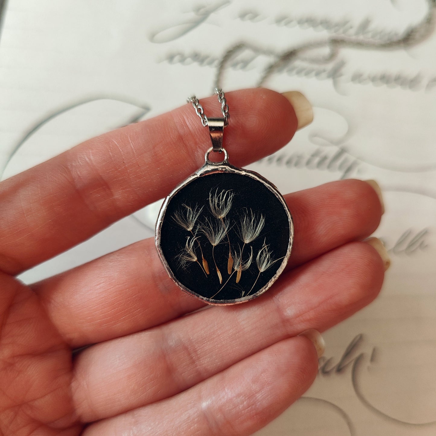 Double-sided mirror and dandelion pendant