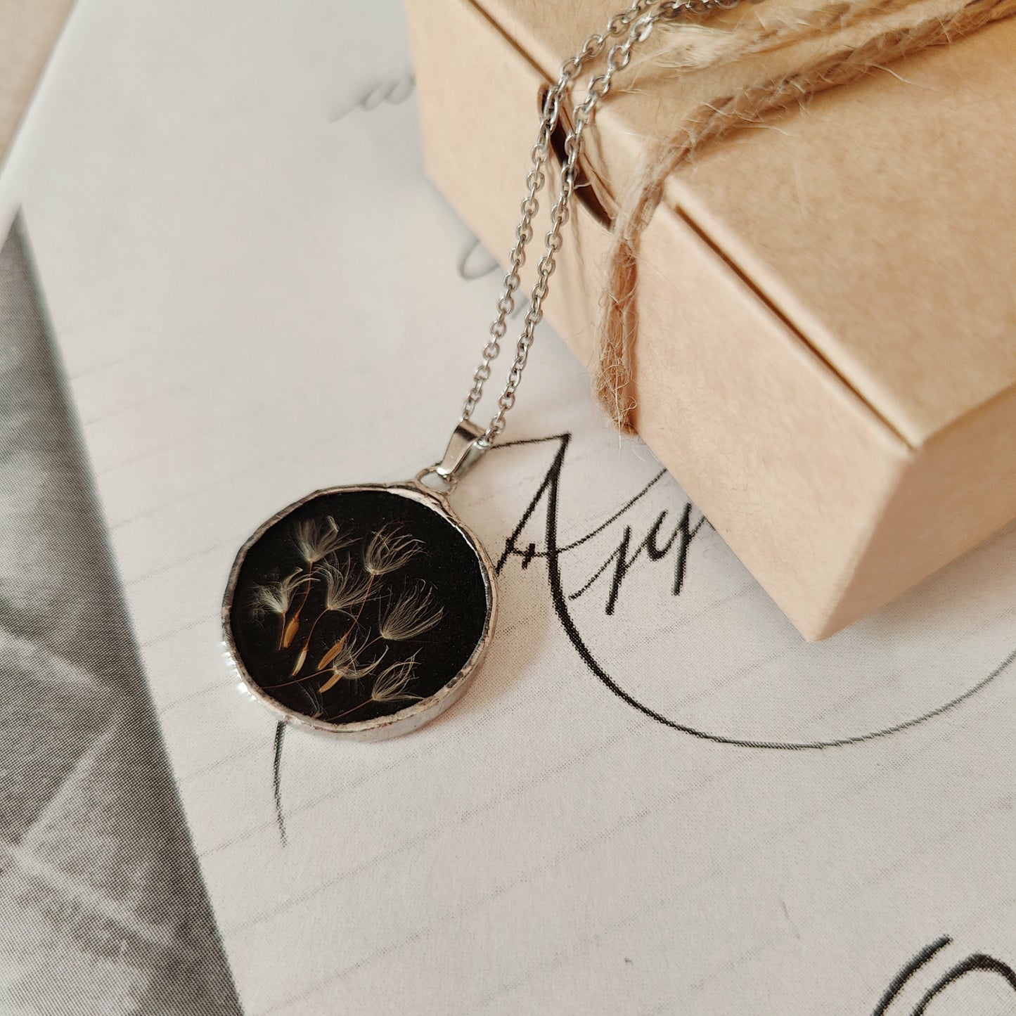 Double-sided mirror and dandelion pendant